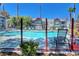 Relaxing community pool area with lounge chairs and lush landscaping at 8600 W Charleston Blvd # 2089, Las Vegas, NV 89117