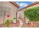Cozy backyard detail with an archway, greenery, and decorative gravel at 8624 Burning Hide Ave, Las Vegas, NV 89143