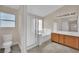 Bright bathroom featuring double vanity, bathtub, and enclosed shower at 8624 Burning Hide Ave, Las Vegas, NV 89143