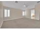 Spacious primary bedroom with carpet, ceiling fan, and shutters at 8624 Burning Hide Ave, Las Vegas, NV 89143