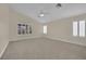 Neutral bedroom with carpet, ceiling fan, and shutters on the windows at 8624 Burning Hide Ave, Las Vegas, NV 89143