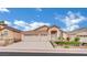 Charming single-story home featuring a three-car garage and manicured landscaping at 8624 Burning Hide Ave, Las Vegas, NV 89143