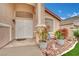 Inviting front entrance with a decorative security door and landscaped garden bed at 8624 Burning Hide Ave, Las Vegas, NV 89143