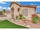 Charming home with a well-kept front yard featuring decorative rock and manicured landscaping at 8624 Burning Hide Ave, Las Vegas, NV 89143