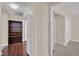 Hallway with access to a bedroom, hardwood floors, and a bookcase with wine storage at 8624 Burning Hide Ave, Las Vegas, NV 89143