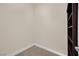 Hallway with access to a bedroom, hardwood floors, and a bookcase with wine storage at 8624 Burning Hide Ave, Las Vegas, NV 89143