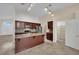 Spacious kitchen featuring a central island, stainless steel appliances, and tile flooring at 8624 Burning Hide Ave, Las Vegas, NV 89143