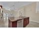 Open kitchen featuring a center island, stainless steel appliances, and views of the backyard at 8624 Burning Hide Ave, Las Vegas, NV 89143