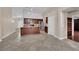 Open kitchen features a center island, stainless steel appliances, and dark wood cabinets at 8624 Burning Hide Ave, Las Vegas, NV 89143