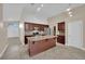 Bright kitchen with a center island, granite countertops, and ample cabinet space at 8624 Burning Hide Ave, Las Vegas, NV 89143