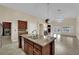 Modern kitchen with an island, stainless steel appliances, and an open layout at 8624 Burning Hide Ave, Las Vegas, NV 89143