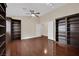 Living room with dark hardwood floors, natural light and custom bookcases at 8624 Burning Hide Ave, Las Vegas, NV 89143