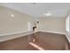 Open-concept living area with hardwood floors, bright lighting, and a view into the kitchen at 8624 Burning Hide Ave, Las Vegas, NV 89143