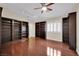 Living room with dark hardwood floors, natural light and custom bookcases at 8624 Burning Hide Ave, Las Vegas, NV 89143