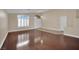 Elegant living room with hardwood floors, large windows, and a cozy atmosphere at 8624 Burning Hide Ave, Las Vegas, NV 89143