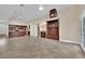 Open concept living room features a bar, a kitchen, and tiled floors at 8624 Burning Hide Ave, Las Vegas, NV 89143