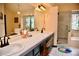 Bright bathroom with double vanity, glass shower, and decorative stained glass at 9113 Anchor Cove Ct, Las Vegas, NV 89117