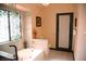 Well-lit bathroom features a bathtub, stylish window, and toilet at 9113 Anchor Cove Ct, Las Vegas, NV 89117