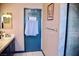 Bright bathroom featuring a double sink vanity and a glass door shower, complete with towel rack at 9113 Anchor Cove Ct, Las Vegas, NV 89117