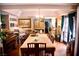 Inviting dining room with large table, hardwood floors, and access to outdoor patio at 9113 Anchor Cove Ct, Las Vegas, NV 89117