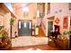 Warm entryway with wood flooring, marble entrance, and staircase at 9113 Anchor Cove Ct, Las Vegas, NV 89117