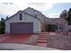 Charming two-story home with a well-manicured front yard and a spacious two-car garage at 9113 Anchor Cove Ct, Las Vegas, NV 89117