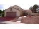 Charming two-story home with a well-manicured front yard and a spacious two-car garage at 9113 Anchor Cove Ct, Las Vegas, NV 89117