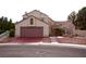 Charming two-story home with a well-manicured front yard and a spacious two-car garage at 9113 Anchor Cove Ct, Las Vegas, NV 89117
