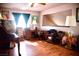 A home office area featuring hardwood floors, desk, ceiling fan and a piano at 9113 Anchor Cove Ct, Las Vegas, NV 89117