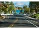 Scenic view of a street leading to a lake, showcasing the community's attractive location and bike-friendly amenities at 9113 Anchor Cove Ct, Las Vegas, NV 89117