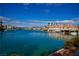 Beautiful waterfront view with luxury homes, private docks, and lush landscaping, offering a serene lifestyle at 9113 Anchor Cove Ct, Las Vegas, NV 89117