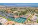 Aerial view of tennis and pickleball courts, pool, and community amenities in a desert setting at 9449 Grand Mesa Dr, Las Vegas, NV 89134