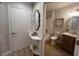 Clean bathroom with modern fixtures, a decorative mirror and a new-looking toilet at 9449 Grand Mesa Dr, Las Vegas, NV 89134