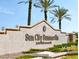 Community entrance sign with landscaping and mature palm trees at 9449 Grand Mesa Dr, Las Vegas, NV 89134