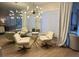 Elegant dining room with modern chandelier and seating at 9449 Grand Mesa Dr, Las Vegas, NV 89134