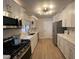 Bright kitchen featuring white cabinets, quartz countertops, and stainless steel appliances at 9449 Grand Mesa Dr, Las Vegas, NV 89134