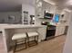 Updated kitchen featuring white cabinets, quartz countertops, and stainless steel appliances at 9449 Grand Mesa Dr, Las Vegas, NV 89134