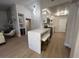 Bright kitchen with modern white cabinetry, quartz countertops, and stainless steel appliances at 9449 Grand Mesa Dr, Las Vegas, NV 89134