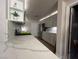 Updated kitchen with white cabinets, quartz countertops, and stainless steel appliances at 9449 Grand Mesa Dr, Las Vegas, NV 89134