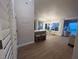 Bright open-concept living area with wood floors, breakfast bar, and large window views at 9449 Grand Mesa Dr, Las Vegas, NV 89134