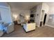 Spacious living room featuring neutral decor, fireplace, and plenty of seating at 9449 Grand Mesa Dr, Las Vegas, NV 89134