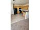 Well-lit kitchen with light wood cabinets, black appliances, and durable hard surface flooring at 10524 Congaree St, Las Vegas, NV 89141