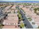 Expansive aerial view of a well-planned community with numerous single-story homes, showcasing a peaceful neighborhood setting at 11007 Vallerosa St, Las Vegas, NV 89141