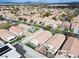 Community aerial showcasing orderly streets, landscaped yards, and evenly-spaced single-Gathering homes, providing a serene residential setting at 11007 Vallerosa St, Las Vegas, NV 89141