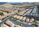 Wide aerial of suburban community with diverse housing, highlighting organized streets and appealing residential design in desert landscape at 11007 Vallerosa St, Las Vegas, NV 89141