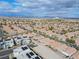 Panoramic aerial view of a large residential area, showing the cohesive arrangement of homes, and overall neighborhood cohesiveness at 11007 Vallerosa St, Las Vegas, NV 89141