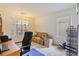 Bright bedroom with a large window and a comfortable seating area at 11007 Vallerosa St, Las Vegas, NV 89141