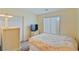Cozy bedroom with a comfortable bed, closet space, and natural light from the window at 11007 Vallerosa St, Las Vegas, NV 89141