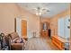 Bright bonus room with hardwood-style floors, a ceiling fan, and lots of natural light at 11007 Vallerosa St, Las Vegas, NV 89141