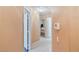 Neutral hallway with tile flooring, leading to bedrooms and other living spaces at 11007 Vallerosa St, Las Vegas, NV 89141